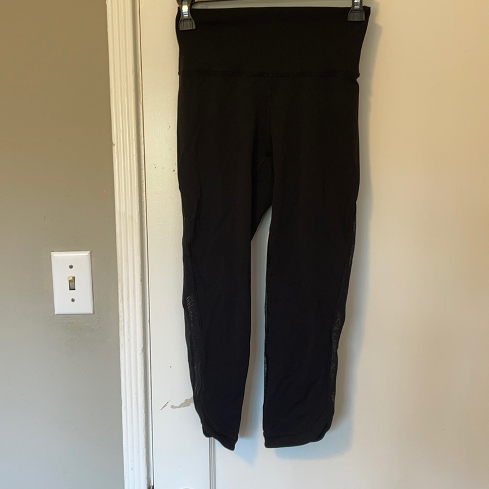 Cropped Black Lululemon leggings with sheer detail